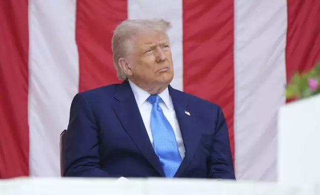 President Donald Trump listens during the 157th National Memorial Day Observance at Arlington National Cemetery, Monday, May 26, 2025, in Arlington, Va. (AP Photo/Jacquelyn Martin)