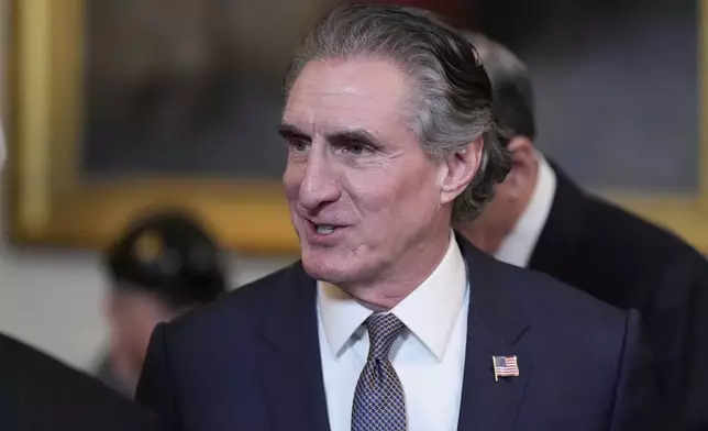 FILE - Interior Secretary Doug Burgum arrives before President Donald Trump speaks during an executive order signing event in the East Room of the White House, Tuesday, April 8, 2025, in Washington. (AP Photo/Alex Brandon,File)