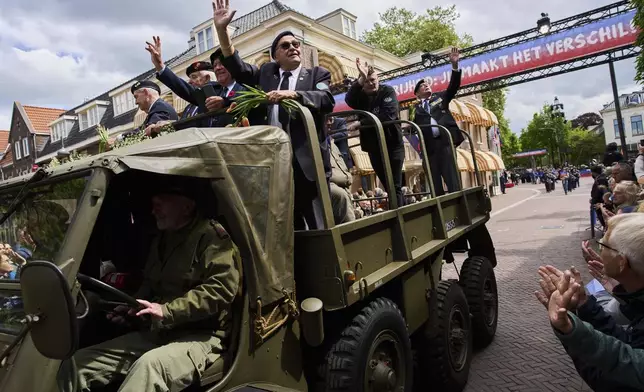 World War II veterans take part in a parade to mark Liberation Day in Wageningen, Netherlands, Monday, May 5, 2025. (AP Photo/Peter Dejong)