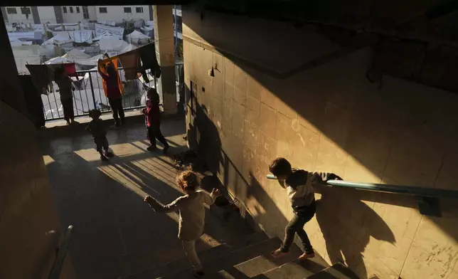 Displaced Palestinians live in a school that has been converted into a shelter in Gaza City amid the ongoing war in Gaza, Tuesday, May 6, 2025. (AP Photo/Jehad Alshrafi)