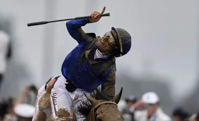 Jockey Junior Alvarado celebrates after riding Sovereignty to victory in the 151st running of the Kentucky Derby horse race at Churchill Downs Saturday, May 3, 2025, in Louisville, Ky. (AP Photo/Brynn Anderson)
