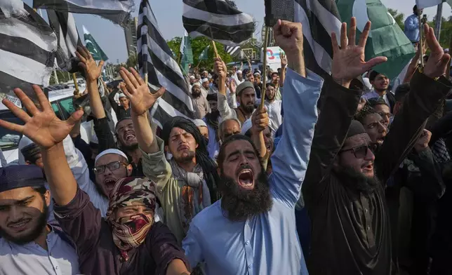 Supporters of a religious party 'Jamiat Ulema-e-Islam-F' chant anti-India slogans during a demonstration to condemn Indian strikes in Pakistan and to show their support with Pakistan military, in Islamabad, Pakistan, Friday, May 9, 2025. (AP Photo/Anjum Naveed)