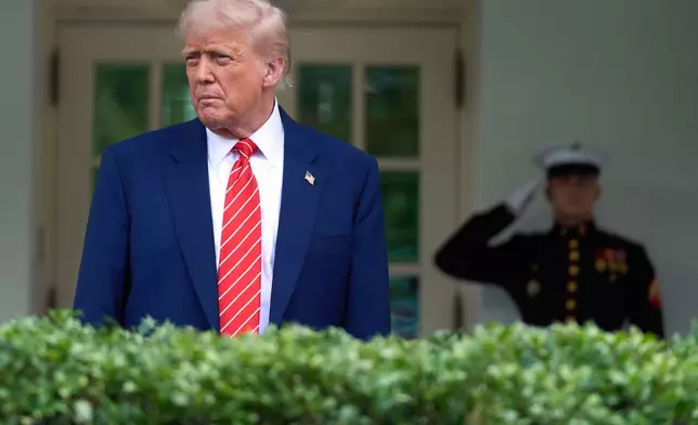 President Donald Trump speaks to reporters outside the West Wing of the White House, Thursday, May 8, 2025, in Washington. (AP Photo/Evan Vucci)