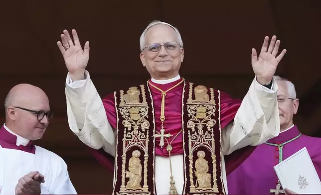 Pope Leo XIV appears on the central loggia of St. Peter's Basilica after being chosen the 267th pontiff of the Roman Catholic Church, at the Vatican, Thursday, May 8, 2025. (AP Photo/Alessandra Tarantino)