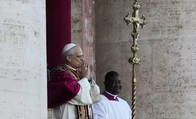Pope Leo XIV appears on the balcony of St Peter's Basilica after his election, at the Vatican, Thursday, May 8, 2025. (AP Photo/Gregorio Borgia)