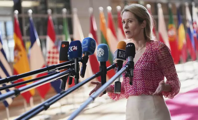 European Union foreign policy chief Kaja Kallas speaks with the media as she arrives for a meeting of EU defense ministers at the European Council building in Brussels, Tuesday, May 20, 2025. (AP Photo/Virginia Mayo)