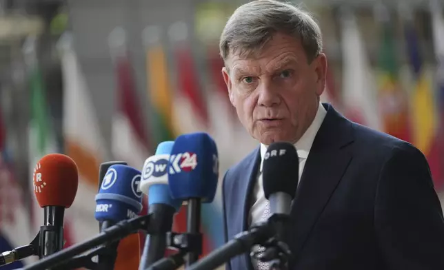 Germany's Foreign Minister Johann Wadephul speaks with the media as he arrives for a meeting of EU foreign ministers at the European Council building in Brussels, Belgium, Tuesday, May 20, 2025. (AP Photo/Virginia Mayo)