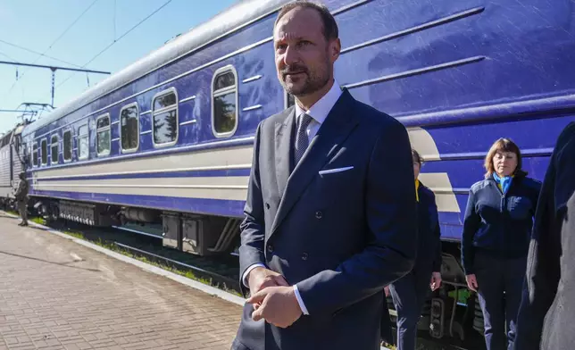 Norway's Crown Prince Haakon arrives at the train station in Kyiv, Ukraine, Tuesday, May 20, 2025. (Heiko Junge/NTB Scanpix via AP)