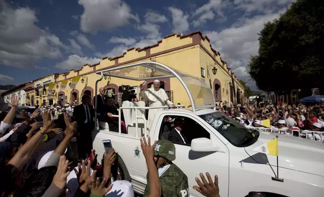 FILE - Pope Francis waves from his popemobile as he leaves the Cathedral in San Cristobal de las Casas, Mexico, Feb. 15, 2016. (AP Photo/Eduardo Verdugo, File)