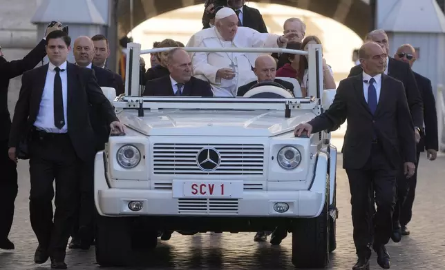 Pope Francis arrives on the popemobile to meet with members of the Comunione e Liberazione (Communion and Liberation) Catholic lay movement in St. Peter's Square at the Vatican, Oct.15, 2022. (AP Photo/Gregorio Borgia)