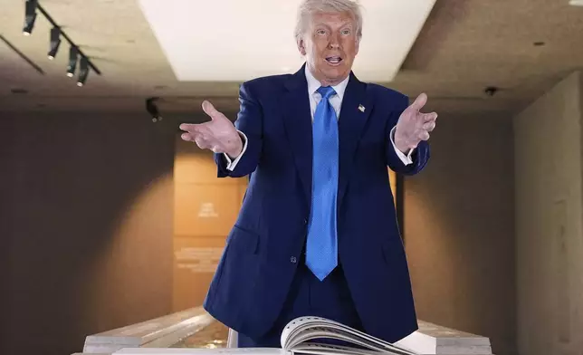 President Donald Trump talks before signing guest book at the Abrahamic Family House, Friday, May 16, 2025, in Abu Dhabi, United Arab Emirates. (AP Photo/Alex Brandon)