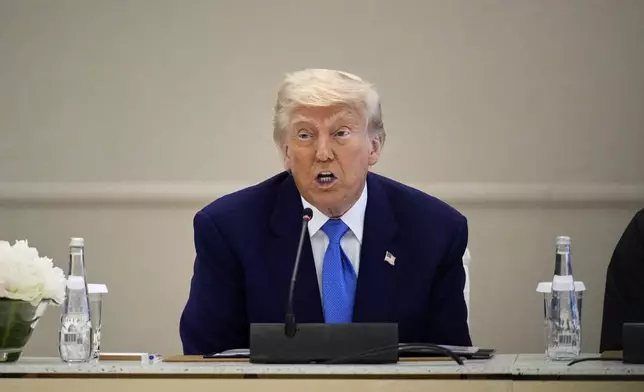 President Donald Trump attends a business meeting and roundtable at Qasr Al Watan, in Abu Dhabi, United Arab Emirates Friday, May 16, 2025. (AP Photo/Altaf Qadri)