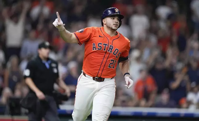 Houston Astros' Yainer Diaz reacts after hitting the game-winning home run against the Tampa Bay Rays during the ninth inning of a baseball game Friday, May 30, 2025, in Houston. (AP Photo/Eric Christian Smith)