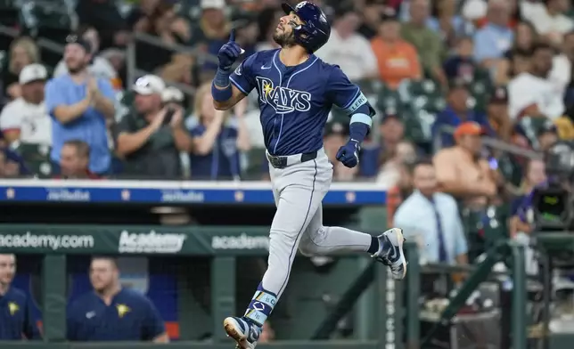 Tampa Bay Rays' Jose Caballero rounds the bases after hitting a solo home run against the Houston Astros during the first inning of a baseball game Friday, May 30, 2025, in Houston. (AP Photo/Eric Christian Smith)