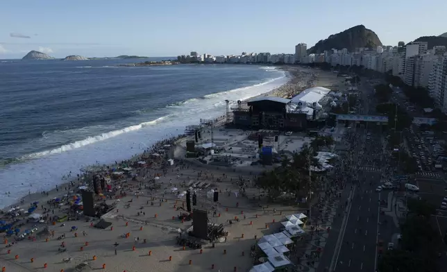 Crews work on a newly constructed stage on Copacabana Beach, Rio de Janeiro, Thursday, May 1, 2025, days ahead of a planned free Lady Gaga concert. (AP Photo/Bruna Prado)