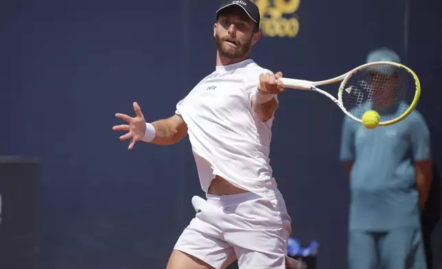 France's Corentin Moutet returns a shot during a round of sixteen match against Britain's Jack Draper at the Italian Open tennis tournament in Rome, Tuesday, May 13, 2025. (AP Photo/Andrew Medichini)