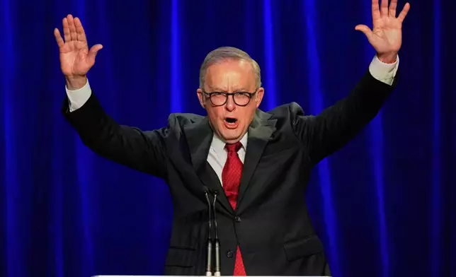 Australian Prime Minister Anthony Albanese reacts as he addresses the party faithful after winning a second term following the general election in Sydney, Saturday, May 3, 2025. (AP Photo/Rick Rycroft)