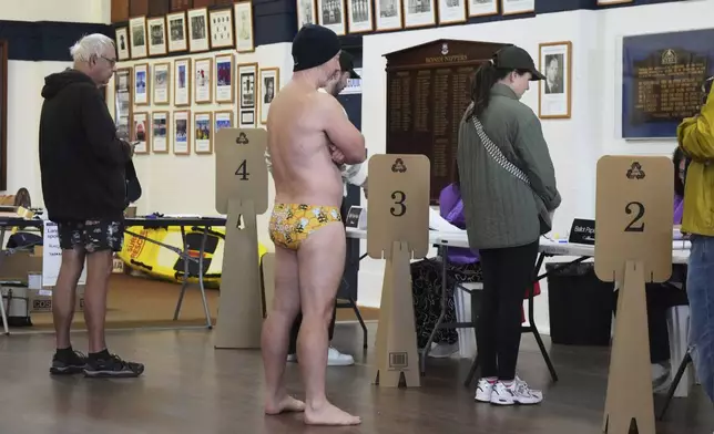 People queue to vote at a polling booth at Sydney's Bondi Beach, Saturday, May 3, 2025. (AP Photo/Mark Baker)