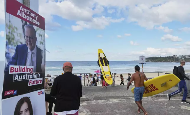 A campaign poster promoting Australian Prime Minister Anthony Albanese is displayed outside a polling station at Sydney's Bondi Beach, Saturday, May 3, 2025. (AP Photo/Mark Baker)