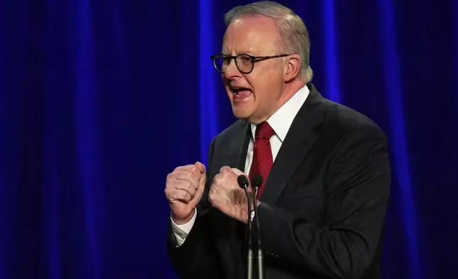 Australian Prime Minister Anthony Albanese reacts as he addresses the party faithful after winning a second term following the general election in Sydney, Saturday, May 3, 2025. (AP Photo/Rick Rycroft)