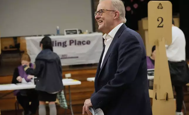 Australian Prime Minister Anthony Albanese reacts as he prepares to vote at a polling booth in his electorate in Sydney, Saturday, May 3, 2025. (AP Photo/Rick Rycroft)