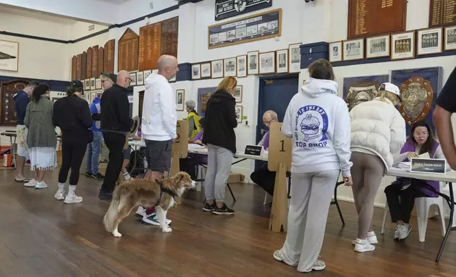 People queue to vote at a polling booth at Sydney's Bondi Beach, Saturday, May 3, 2025. (AP Photo/Mark Baker)
