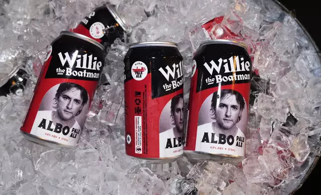 Beer cans featuring a photo of Australian Prime Minister Anthony Albanese sit in an ice bucket at a Labor Party event in Sydney, Saturday, May 3, 2025. (AP Photo/Rick Rycroft)