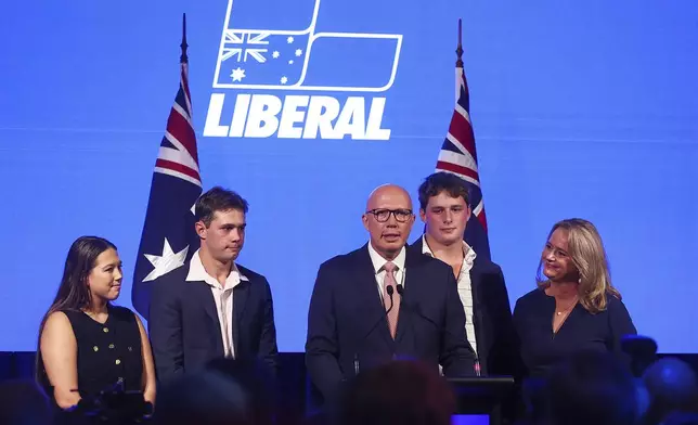 Australian Liberal Party leader Peter Dutton, third left, stands with his family as he makes his concession speech following the general election in Brisbane, Australia, Saturday, May 3, 2025. (AP Photo/Pat Hoelscher)