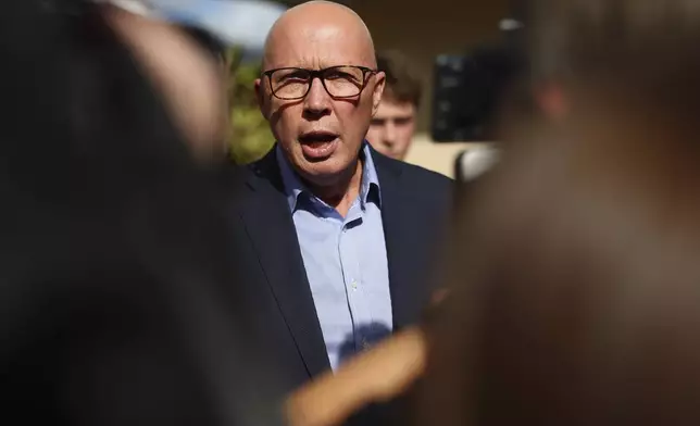 Australian Liberal Party leader Peter Dutton talks to the media after voting in his electorate in Brisbane, Australia, Saturday, May 3, 2025. (AP Photo/Pat Hoelscher)