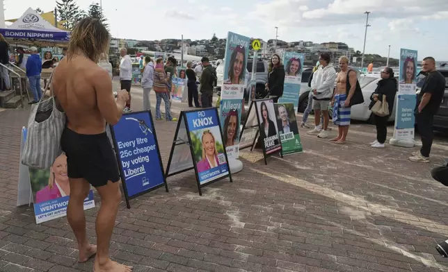People queue outside at a polling booth at Sydney's Bondi Beach, Saturday, May 3, 2025. (AP Photo/Mark Baker)