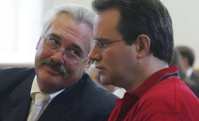 FILE - Defense attorney Gerald Kelly confers with defendant Stephen Stanko during a pretrial hearing at the Georgetown County Courthouse in Georgetown, S.C., Monday, July 31, 2006. (AP Photo/Tom Murray, Pool, File)