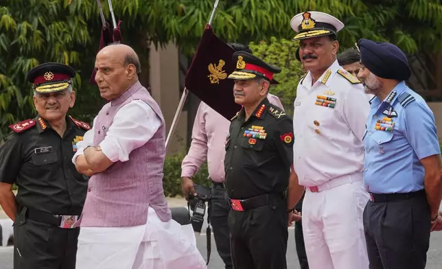 Indian Defense Minister Rajnath Singh, second left, with three Indian defense chiefs, Army General Upendra Dwivedi, third right, Naval Admiral Dinesh K Tripathi, second right, and Air Force Air Chief Marshal A P Singh, right, and Indian Chief of Defense Staff General Anil Chauhan, left, wait for the arrival of Japan's Defense Minister General Nakatani in New Delhi, India, Monday, May 5, 2025. (AP Photo/Manish Swarup)