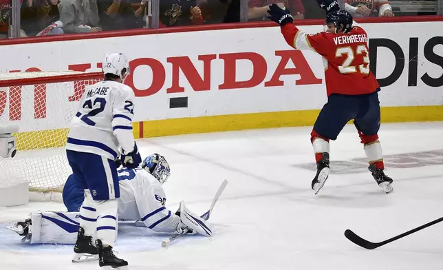 Florida Panthers center Carter Verhaeghe (23) celebrates after scoring during the first period of Game 4 of a second-round NHL hockey playoff series against the Toronto Maple Leafs, Sunday, May 11, 2025, in Sunrise, Fla. (AP Photo/Michael Laughlin)
