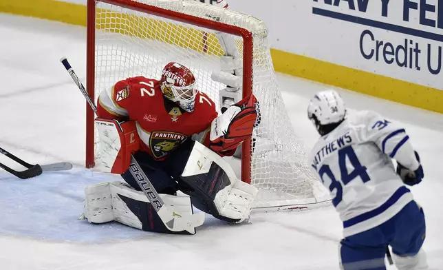 Florida Panthers goaltender Sergei Bobrovsky (72) catches the puck in front of Toronto Maple Leafs center Auston Matthews (34) during the first period of Game 4 of a second-round NHL hockey playoff series, Sunday, May 11, 2025, in Sunrise, Fla. (AP Photo/Michael Laughlin)