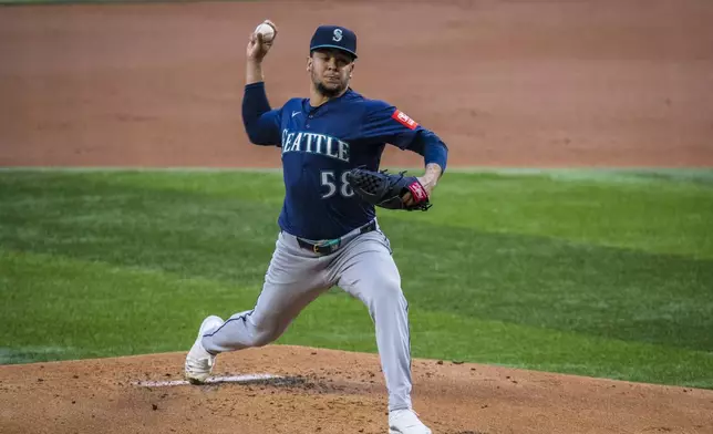 Seattle Mariners' Luis Castillo pitches during the first inning of a baseball game against the Texas Rangers, Saturday, May 3, 2025, in Arlington, Texas. (AP Photo/Jessica Tobias)
