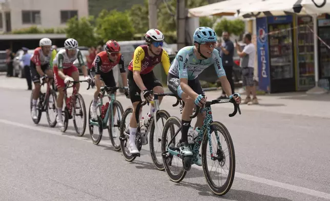 The pack rides during the stage 1 of the Giro d'Italia from Durazzo (Durres) to Tirana (Tirane), Albania, Friday, May 9, 2025. (Fabio Ferrari/LaPresse via AP)