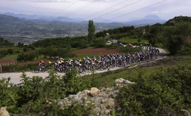 The pack rides during the stage 1 of the Giro d'Italia from Durazzo (Durres) to Tirana (Tirane), Albania, Friday, May 9, 2025. (Fabio Ferrari/LaPresse via AP)