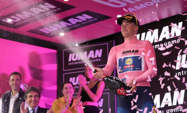 Mads Pedersen of Lidl-Trek, right, celebrates winning stage 1 of the Giro d'Italia from Durazzo (Durres) to Tirana (Tirane), Albania, Friday, May 9, 2025. (Massimo Paolone/LaPresse via AP)