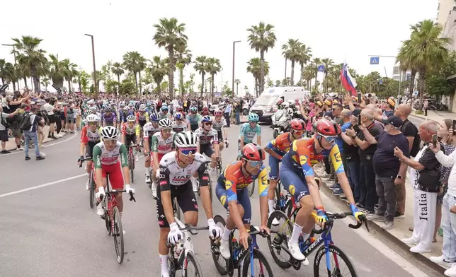 The pack rides cycles through the during the stage 1 of the Giro d'Italia from Durazzo (Durres) to Tirana (Tirane), Albania, Friday, May 9, 2025. (Massimo Paolone/LaPresse via AP)