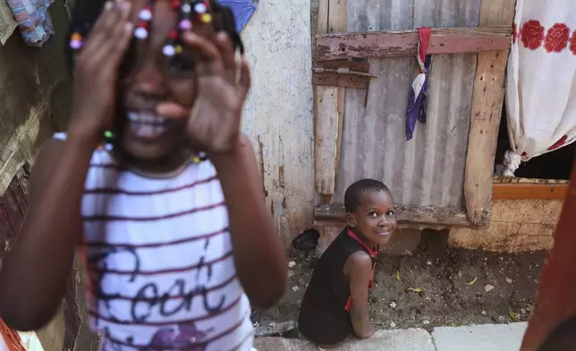 Children play at a shelter for families displaced by gang violence in Port-au-Prince, Haiti, Thursday, May 22, 2025. (AP Photo/Odelyn Joseph)