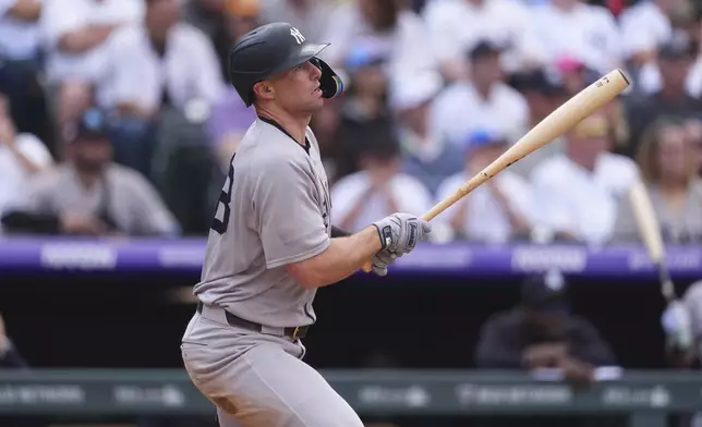 New York Yankees' Paul Goldschmidt singles against Colorado Rockies starting pitcher Kyle Freeland in the third inning of a baseball game Saturday, May 24, 2025, in Denver. (AP Photo/David Zalubowski)
