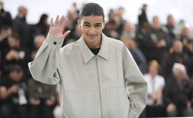 Louai El Amrousy poses for photographers at the photo call for the film 'Alpha' at the 78th international film festival, Cannes, southern France, Tuesday, May 20, 2025. (AP Photo/Natacha Pisarenko)