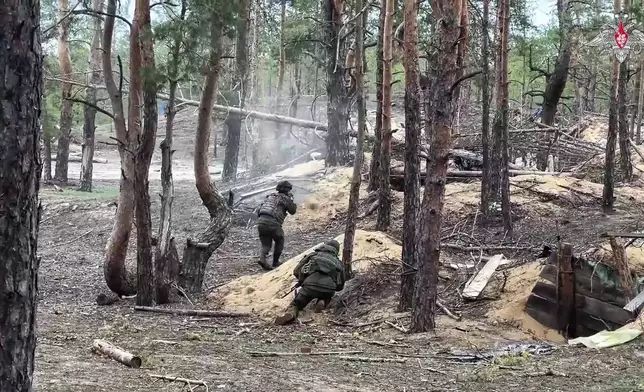 In this photo taken from video distributed by Russian Defense Ministry Press Service on Wednesday, May 21, 2025, Russian servicemen attend a combat training for assault units in an undisclosed location in Ukraine. (Russian Defense Ministry Press Service via AP)