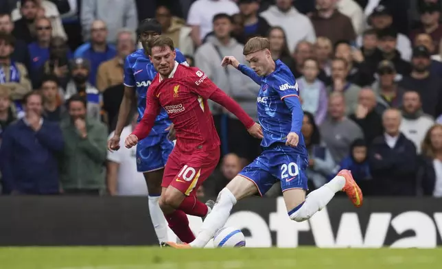 Liverpool's Alexis Mac Allister, left, and Chelsea's Cole Palmer compete for the ball during the English Premier League soccer match between Chelsea and Liverpool at Stamford Bridge stadium in London, Sunday, May 4, 2025. (AP Photo/Kin Cheung)