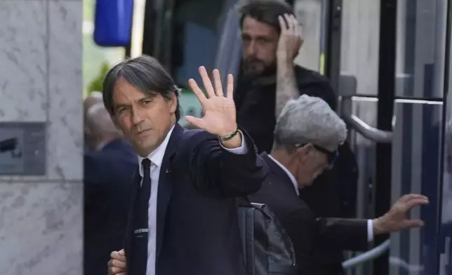 Inter Milan's head coach Simone Inzaghi waves to supporters as Inter team arrive at their hotel ahead of Saturday's Champions League final soccer match between Paris Saint-Germain and Inter Milan, in Munich, Germany, Friday, May 30, 2025. (AP Photo/Luca Bruno)