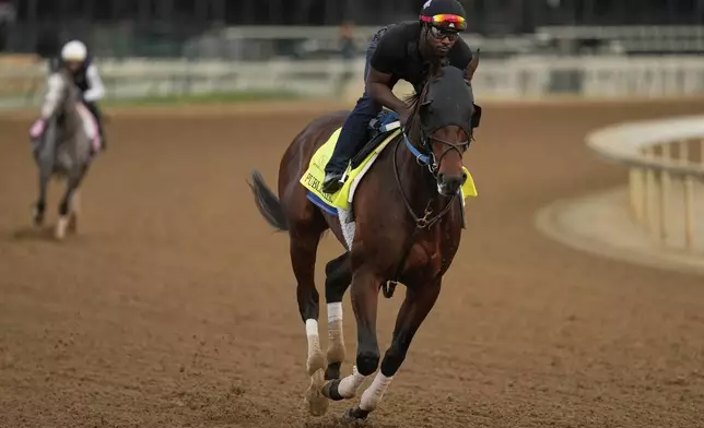 Kentucky Derby entrant Publisher works out at Churchill Downs Tuesday, April 29, 2025, in Louisville, Ky. (AP Photo/Charlie Riedel)