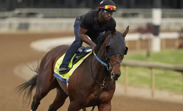 Kentucky Derby entrant Publisher works out at Churchill Downs Tuesday, April 29, 2025, in Louisville, Ky. (AP Photo/Charlie Riedel)