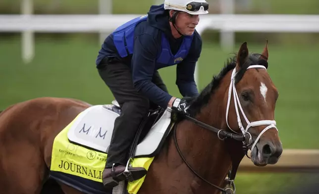 Kentucky Derby entrant Journalism works out at Churchill Downs Wednesday, April 30, 2025, in Louisville, Ky. (AP Photo/Charlie Riedel)