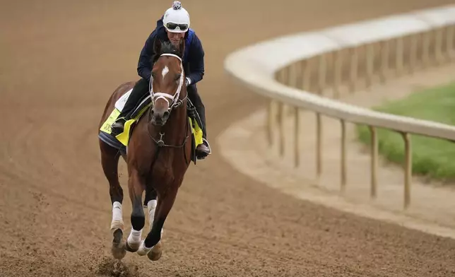 Kentucky Derby entrant Journalism works out at Churchill Downs Wednesday, April 30, 2025, in Louisville, Ky. (AP Photo/Charlie Riedel)