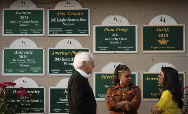Trainer Bob Baffert talks to visitors outside his barn at Churchill Downs Tuesday, April 29, 2025, in Louisville, Ky. (AP Photo/Charlie Riedel)